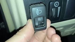Замена лампочки в кнопке корректора фар Toyota Land Cruiser Prado 120