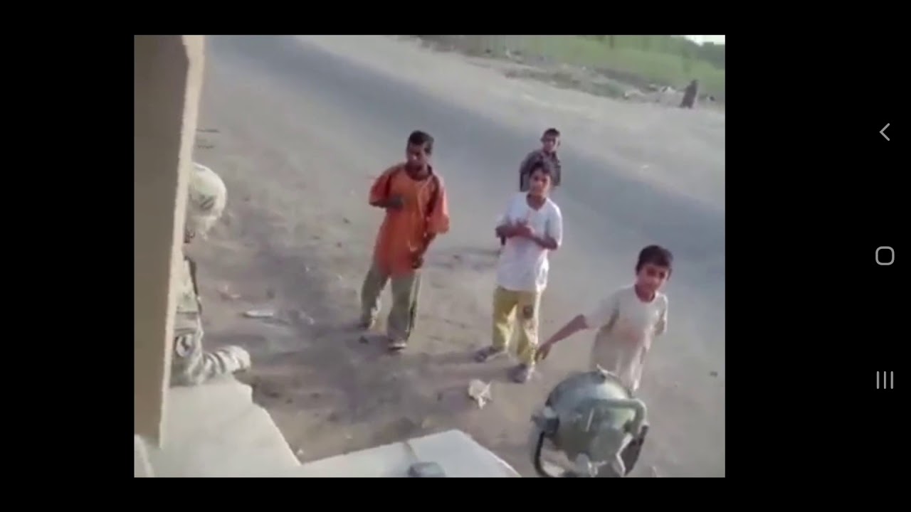 US troops in Iraq playing with kids