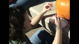 College Students Carving Pumpkins