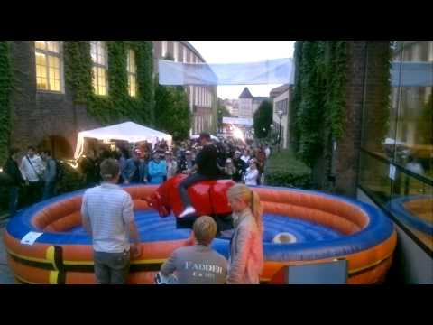 Mechanical bull meets his match at the pledge party.