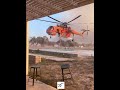 Erickson air crane helicopter taking water from hotel pool  rhodes wildfires