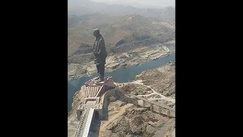 Helicopter view of Statue of Unity and Sardar Sarovar Dam