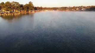 Drone flying through light morning fog on Lake LBJ in Sunrise Beach