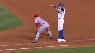 CIN@LAD: Votto dramatically removes a paper airplane