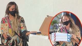 Chrissy Teigen Is Feeling Charitable As She Shares Pizza With The Paps