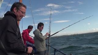 Fishing for mackerel off the coast of Norfolk in the stormy northern seas