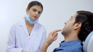 Stock video of a beautiful young doctor speaking to the patient at her clinic