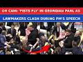 Georgia Parliament Erupts In Chaos As Lawmakers Trade Punches During PM Irakli's Speech | WATCH
