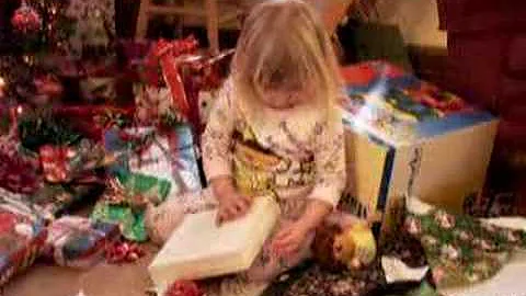 Emily opens presents at the Vokes house