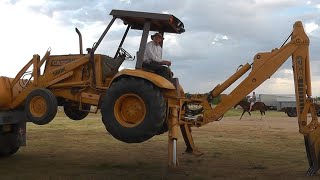 88YearOldLearningToLoadBackhoeOnDumpTruckNoRamps