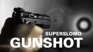 super slow-motion video of shooting guns and flying bullets