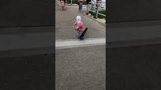 Boy on scooter jumps over crack in sidewalk and faceplants