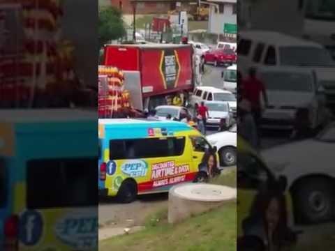 Watch people steal of a moving truck!!!