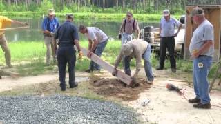 Men gathered Saturday morning to dig holes, erect cedar posts, and install plates for our pond picnic shelter. This work is being ...