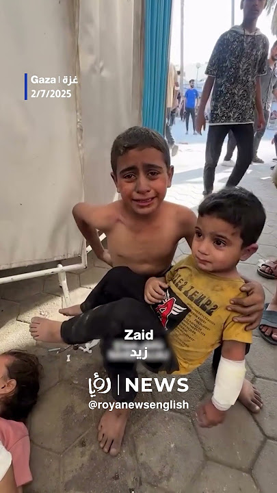 Injured child comforts siblings after “Israeli” strike on shelter