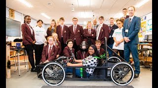 Nishi helping to build a racing car to promote STEM subjects