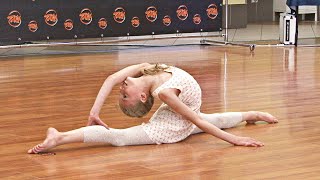 Acrobatic rhythmic gymnastics competition, baby girl kindersport dance