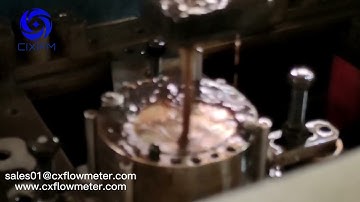 In the production test of CIXI micro flow meter gear flow meter low flow sensor used for glue oil...