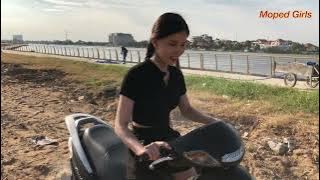 Challenging Girl Run The Bike Scooter Through A Pile Of Ruts