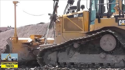 CAT D6 Dozer Working With Some Massive Earth Scrapers