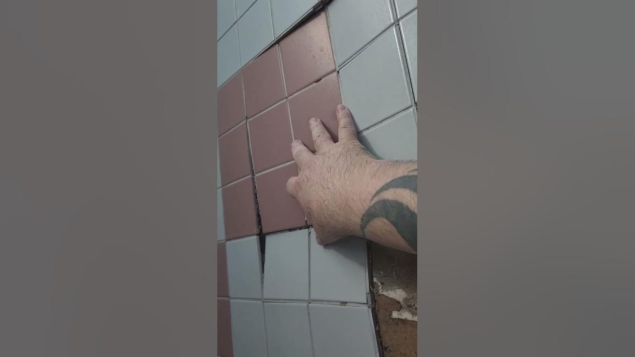 Why are my shower walls squishy, and why are my tiles falling off