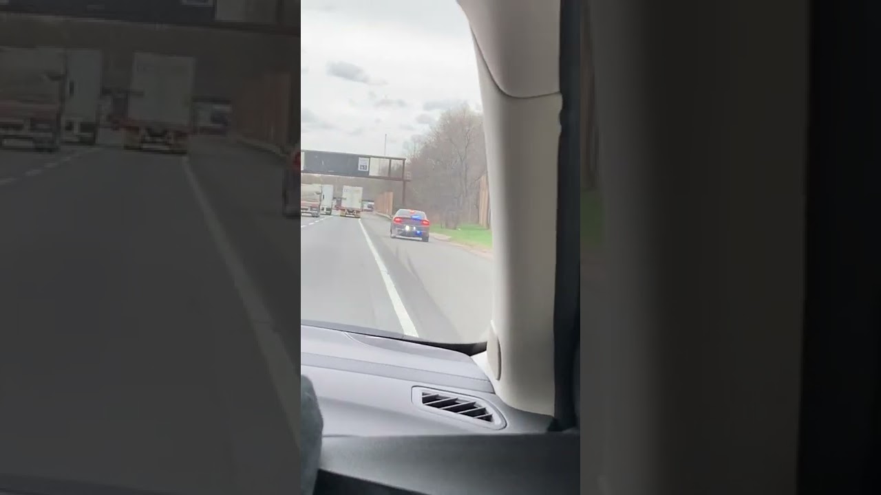 Unmarked charger pulling over a car on I-95
