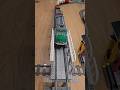 Top view of a LEGO freight train crossing the bridge 🚂