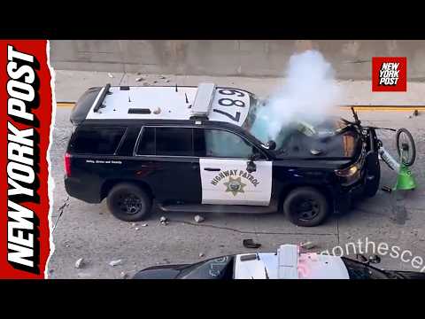 Rioters bombard police from overpass – hurling rocks, fireworks and scooters