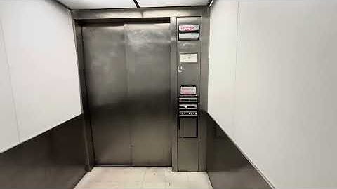 Super beat up Dover Impulse Hydraulic elevator at Marshall in Glendale California