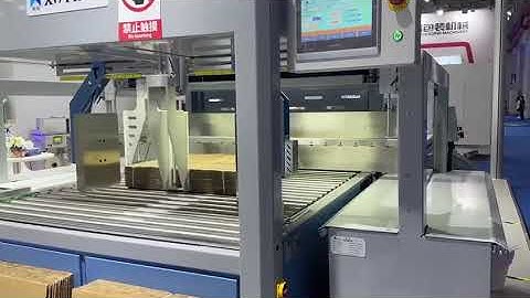 Duble head squaring and strapping machine for corrugated industry, output 24 bundles per minute.