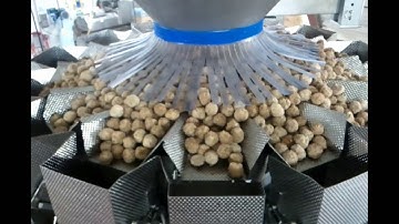 PrimoCombi® multihead weigher dispensing frozen meatballs into vertical form and sealed pouches