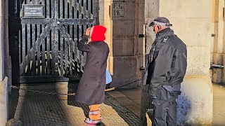 NOT AGAIN! POLICE tell an overenthusiastic tourist she's too close to The King's Guard!