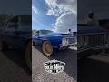 Oldsmobile Cutlass on 24” gold Dayton wire wheels