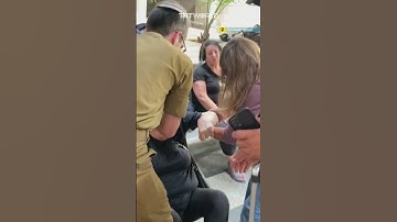 Thumbnail of Israelis take cover at Tel Aviv train station as sirens wail