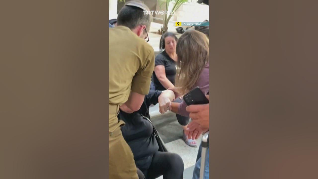 Israelis take cover at Tel Aviv train station as sirens wail