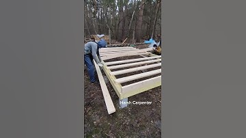 Installation of Floor Joists During The Construction of a Small Guest House