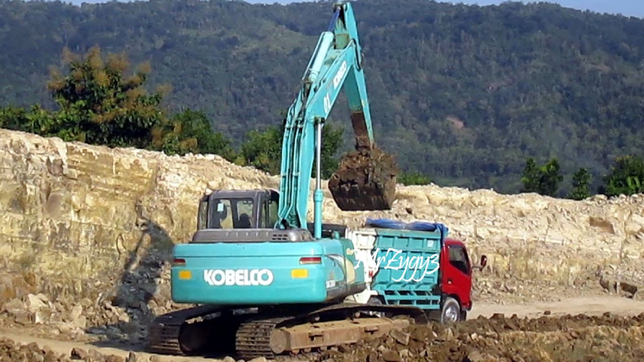 Kobelco SK200 Geospec Excavator Filling Dump  Truck  Toyota 