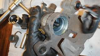 : Dismantling and cleaning Mazda 626 rear caliper