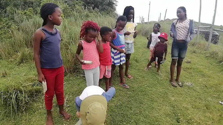William buchan handing out food to all the childre...