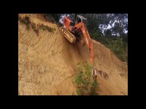 Epic Driving Backhoe go down from the Hill.