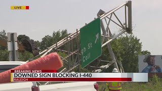 Downed sign blocking I-440, major traffic delays