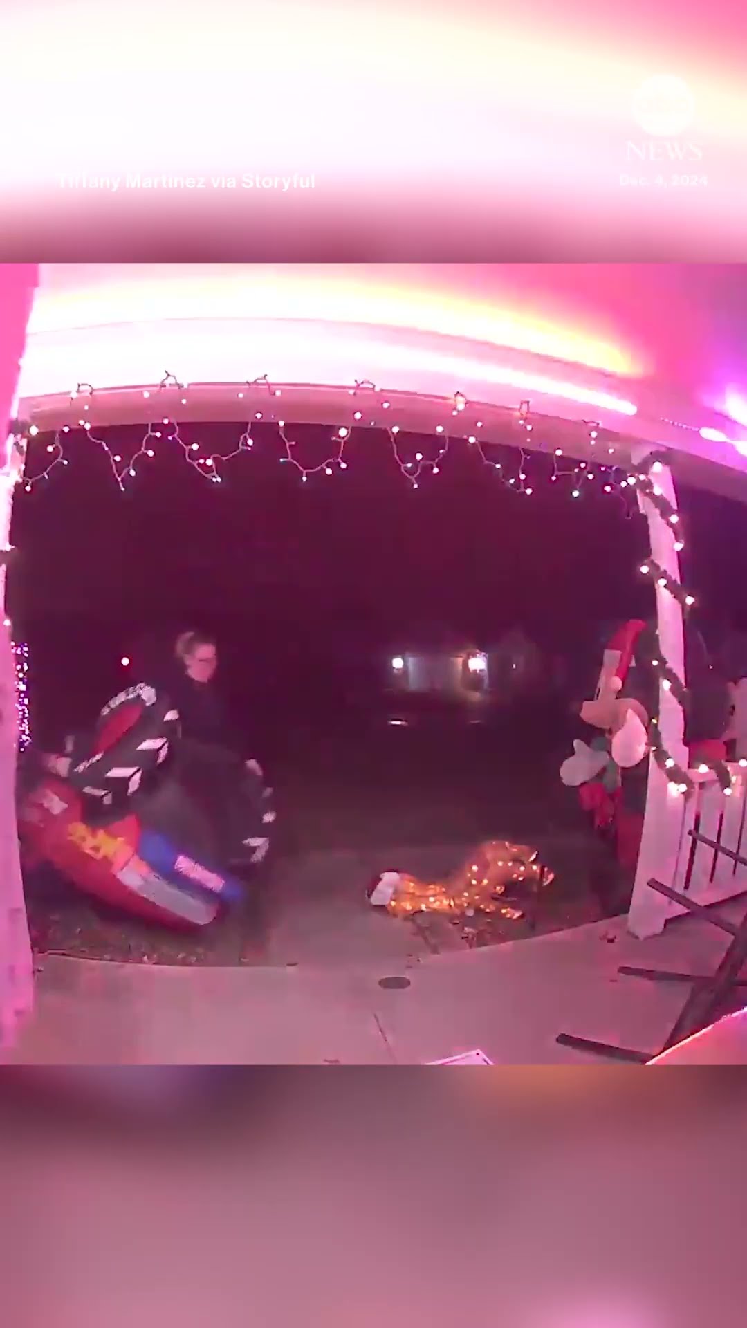 Inflatable Santa waves goodbye as it's blown off porch