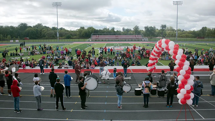 The Kent City High School Marching Band sets the p...