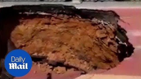 Sinkhole almost swallows up a bus with 21 passengers onboard - Daily Mail