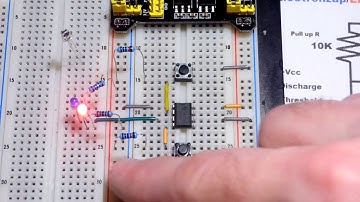 Photodiode replacing push button switch in 555 timer bistable mode flip flop circuit