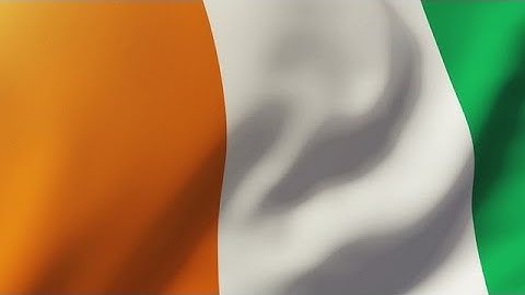 Ivory Coast Flag Waving In The Wind. Looping Sun Rises Style. Animation Loop Stock Animation