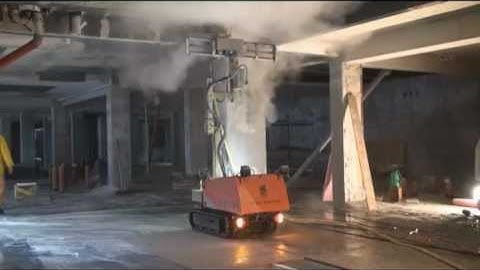 Robot concrete surface treatment in a hotel.wmv