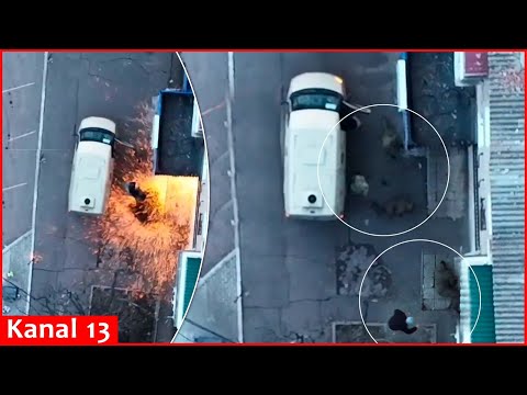 Drone targets Russian policemen trying to get into a car in Donetsk