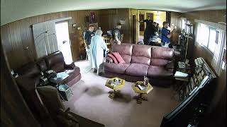 Footage show the tense moments authorities raid a 98-year-old woman's home in Kansas