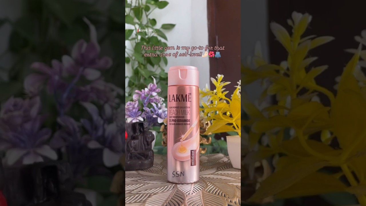 Cute Lakmé Peach Milk Moisturiser with 2% Pro Ceramide, nestled among pretty plants and flowers!🌿💕